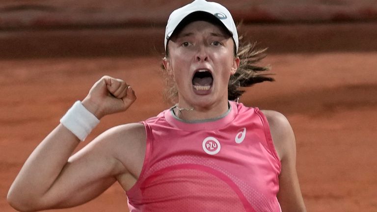 Poland's Iga Swiatek celebrates after defeating Ukraine's Marta Kostyuk during in fourth round match on day 9, of the French Open tennis tournament at Roland Garros in Paris, France, Monday, June 7, 2021. (AP Photo/Christophe Ena)