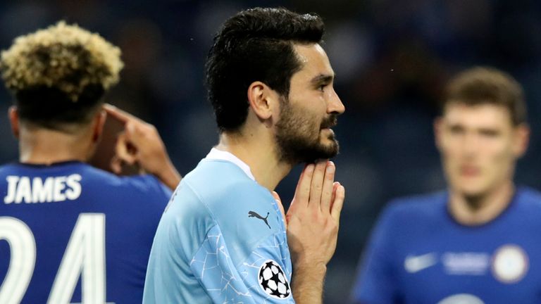 Manchester City's Ilkay Gundogan, center, reacts during the Champions League final soccer match between Manchester City and Chelsea at the Dragao Stadium in Porto, Portugal, Saturday, May 29, 2021. (Jose Coelho/Pool via AP)