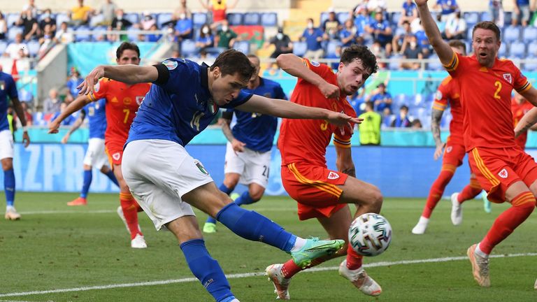 Italy's Federico Chiesa attempts a shot against Wales