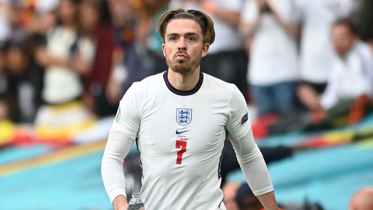 England&#39;s Jack Grealish stands by the pitch as Germany&#39;s manager Joachim Loew is seen at left, during the Euro 2020 soccer championship round of 16 match between England and Germany, at Wembley stadium in London, Tuesday, June 29, 2021. (Andy Rain, Pool via AP)