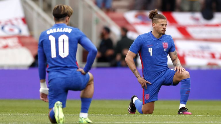 England&#39;s Jack Grealish and Kalvin Phillips take a knee before their warm-up fixture against Romania