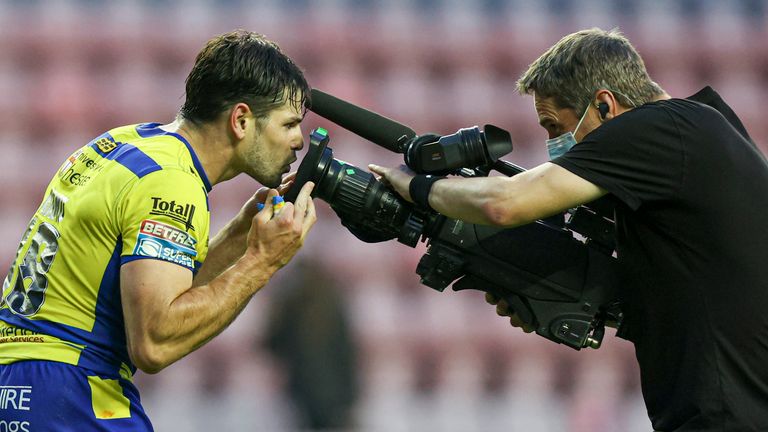 Jake Mamo celebrates scoring his third and hat-trick try by kissing the TV camera