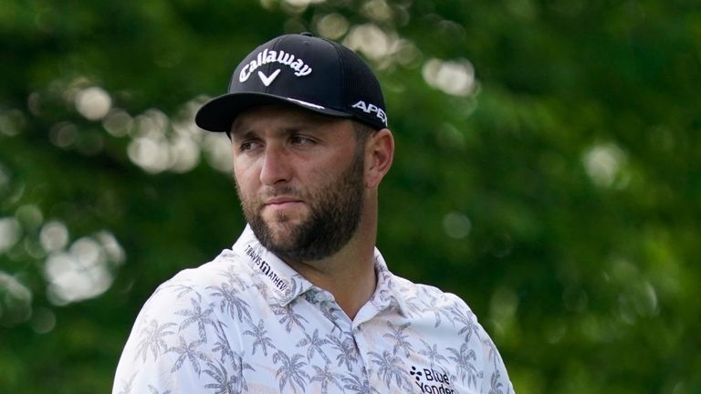 Jon Rahm talks with his caddie as he waits to hit on the 14th tee during the third round of the Memorial golf tournament, Saturday, June 5, 2021, in Dublin, Ohio. (AP Photo/Darron Cummings) 
