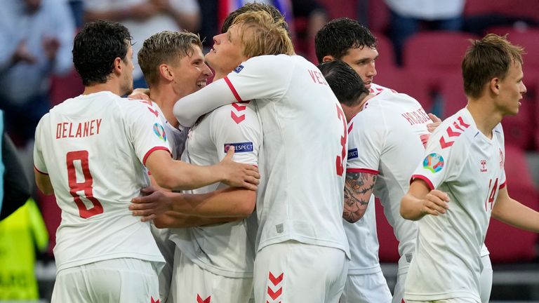 Denmark's Kasper Dolberg celebrates with team-mates after scoring his sides second goal during the Euro 2020 soccer championship round of 16 match between Wales and Denmark
