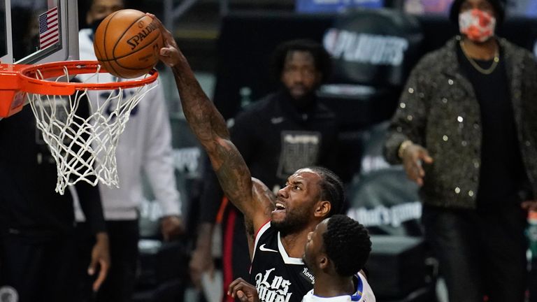 Los Angeles Clippers forward Kawhi Leonard dunks the ball against Dallas Mavericks forward Dorian Finney-Smith during Game 7 of an NBA basketball first-round playoff series