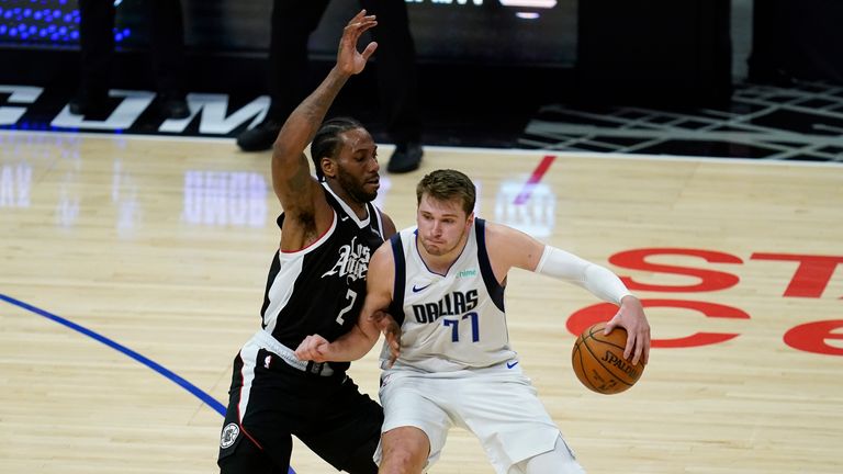 Los Angeles Clippers forward Kawhi Leonard defends against Dallas Mavericks guard Luka Doncic during Game 7 of an NBA basketball first-round playoff series