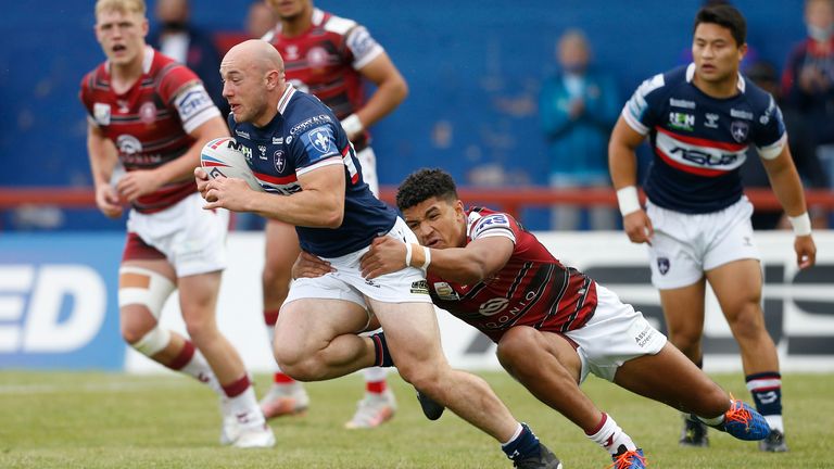 Wakefield Trinity's Lee Kershaw looks to get past Kai Pearce-Paul