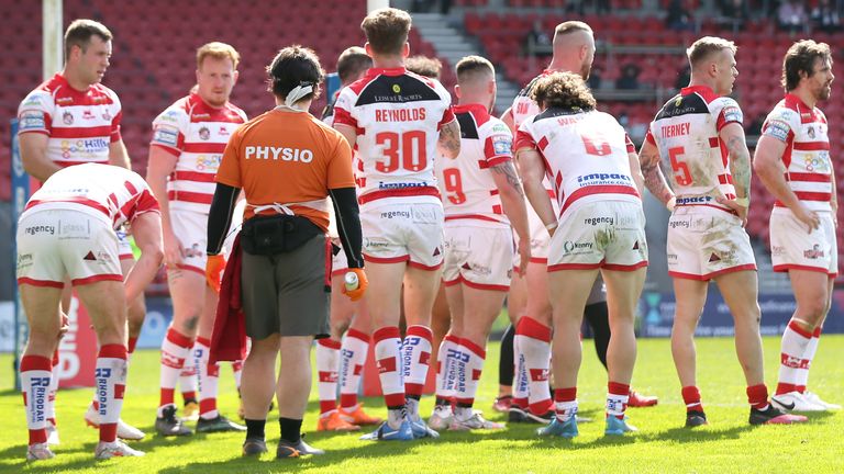 Leigh Centurions players appear dejected in front of an empty stadium during the Betfred Super League match at The Totally Wicked Stadium, St Helens. Picture date: Friday April 2, 2021.