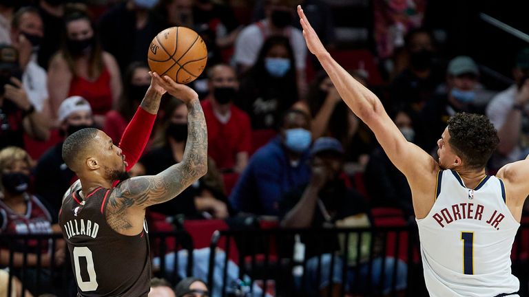 Portland Trail Blazers guard Damian Lillard shoots a 3-point basket over Denver Nuggets forward Michael Porter Jr. during Game 6 of an NBA basketball first-round playoff series