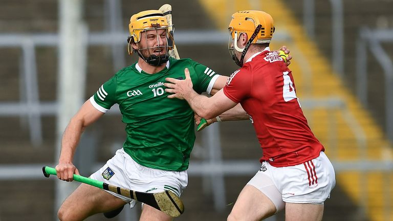Tom Morrissey of Limerick is tackled by Niall O'Leary of Cork