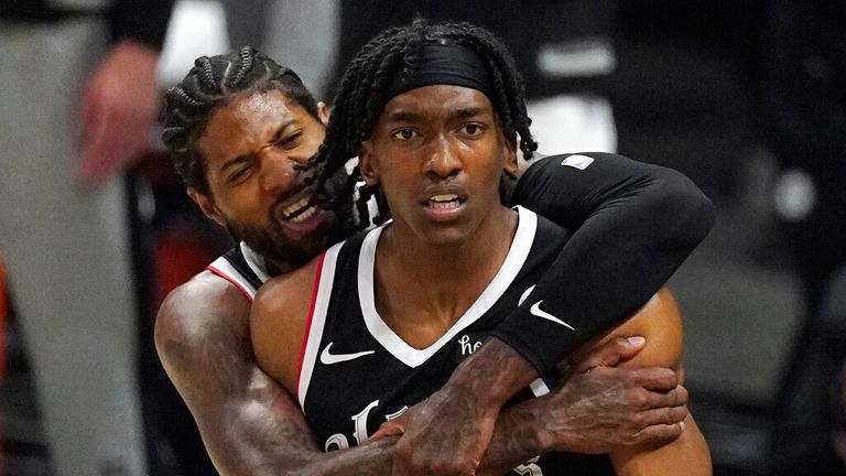 Los Angeles Clippers guard Terance Mann, right, celebrates with guard Paul George after scoring and drawing a foul during the first half in Game 6 of a second-round NBA basketball playoff series against the Utah Jazz Friday, June 18, 2021, in Los Angeles. (AP Photo/Mark J. Terrill)