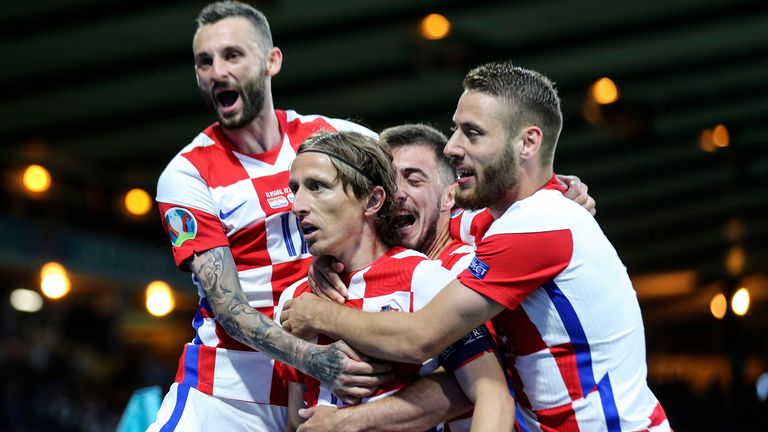 Croatia's Luka Modric is celebrated after scoring his side's second goal during the Euro 2020 soccer championship group D match between Croatia and Scotland at the Hampden Park