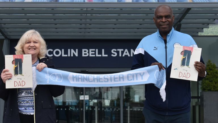 Children's author Susan Quinn handing over copies of her latest book 'My Dad' to CITC's Ambassador and former Manchester City goalkeeper Alex Williams