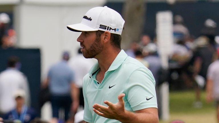 Matthew Wolff reacts towards the gallery after chipping onto the first green during the final round of the U.S. Open Golf Championship, Sunday, June 20, 2021, at Torrey Pines Golf Course in San Diego. (AP Photo/Gregory Bull)