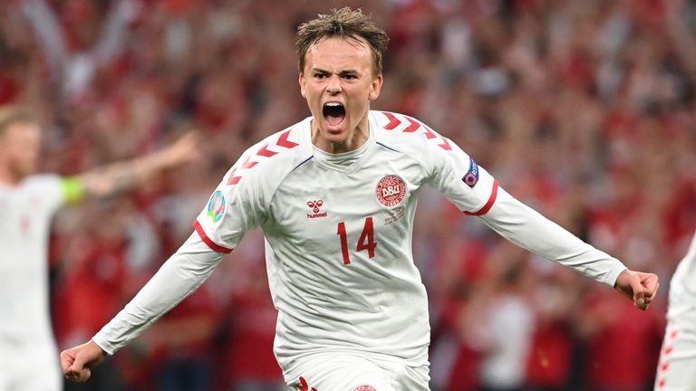 Denmark's Mikkel Damsgaard celebrates after scoring his side's opening goal during the Euro 2020 soccer championship group B match between Russia and Denmark