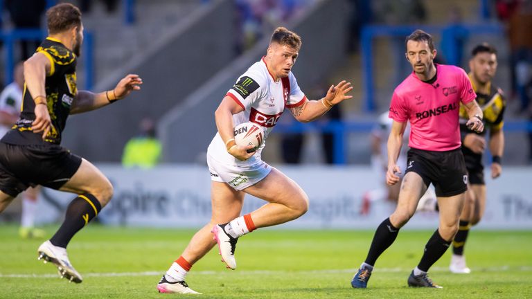 England's Morgan Knowles breaks free from the All Stars to score a try.