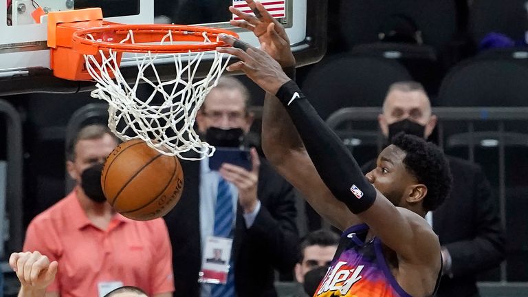 Phoenix Suns center Deandre Ayton, top right, scores over Los Angeles Clippers center Ivica Zubac during the second half of Game 2 of the NBA basketball Western Conference Finals, Tuesday, June 22, 2021, in Phoenix. 
