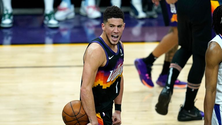 Phoenix Suns guard Devin Booker shouts in celebration in the closing seconds during the second half of Game 1 of the NBA basketball Western Conference finals against the Los Angeles Clippers, Sunday, June 20, 2021, in Phoenix. The Suns defeated the Clippers 120-114. (AP Photo/Ross D. Franklin)


