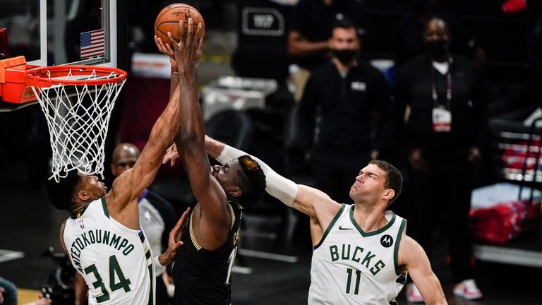 Milwaukee Bucks forward Giannis Antetokounmpo (34) rejects Atlanta Hawks center Clint Capela (15) scoring during the second half of Game 4 of the NBA Eastern Conference basketball finals Tuesday, June 29, 2021, in Atlanta.