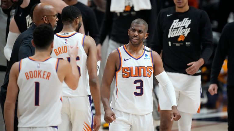 Phoenix Suns guard Chris Paul congratulates teammates during a time out in the second half of Game 4 of an NBA second-round playoff series against the Denver Nuggets Sunday, June 13, 2021, in Denver.  (AP Photo/David Zalubowski)...................