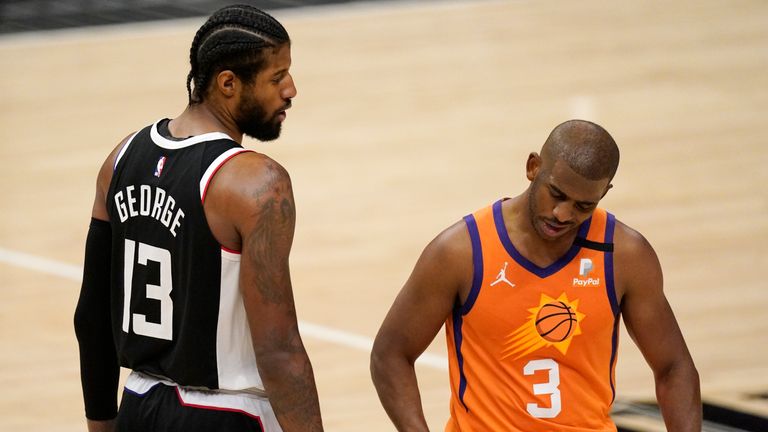 Los Angeles Clippers guard Paul George, left, tires to talk to Phoenix Suns guard Chris Paul during the second half in Game 3 of the NBA basketball Western Conference Finals Thursday, June 24, 2021, in Los Angeles. (AP Photo/Mark J. Terrill)


