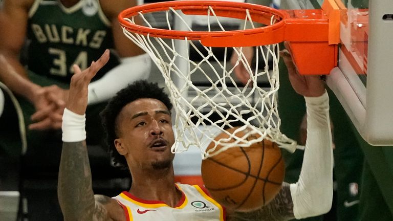 Atlanta Hawks' John Collins dunks during the second half of Game 1 of the NBA Eastern Conference basketball finals game against the Atlanta Hawks Wednesday, June 23, 2021, in Milwaukee. (AP Photo/Morry Gash)


