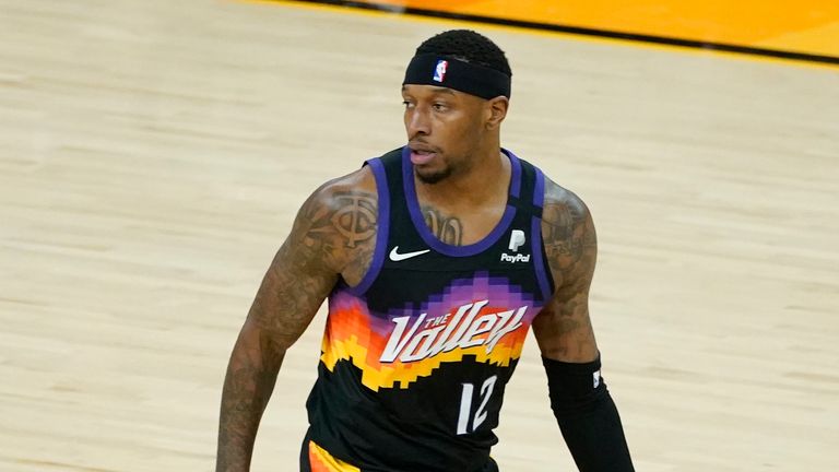 Phoenix Suns forward Torrey Craig (12) signals three after making a three pointer against the Denver Nuggets during Game 1 of an NBA basketball second-round playoff series, Monday, June 7, 2021, in Phoenix.