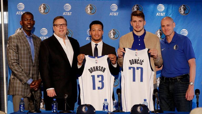Michael Finley (left), Donnie Nelson and Dallas Mavericks Head Coach Rick Carlisle (right) unveil 2018 draft picks Jalen Brunson and Luka Doncic  at the American Airlines Center in Dallas, Texas.