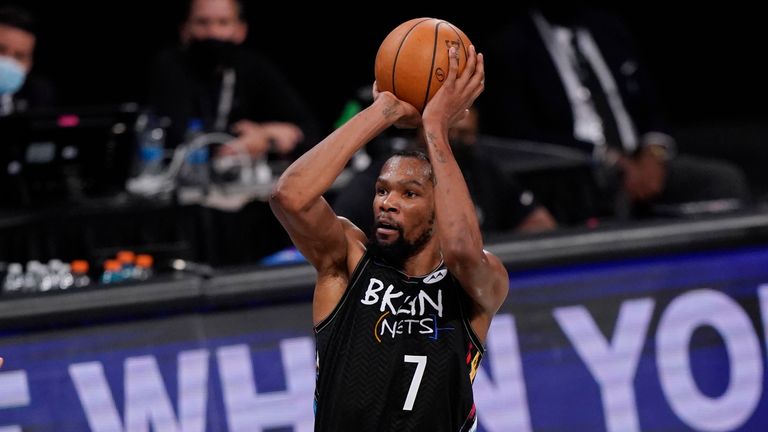 Brooklyn Nets forward Kevin Durant (7) shoots as Milwaukee Bucks forward P.J. Tucker (17) defends during the second half of Game 2 of an NBA basketball second-round playoff series, Monday, June 7, 2021, in New York.