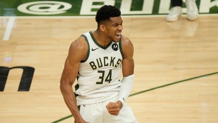 Milwaukee Bucks&#39; Giannis Antetokounmpo reacts after teammate Khris Middleton made a three-point basket during the second half of Game 4 of the NBA Eastern Conference basketball semifinals game against the Brooklyn Nets Sunday, June 13, 2021, in Milwaukee.