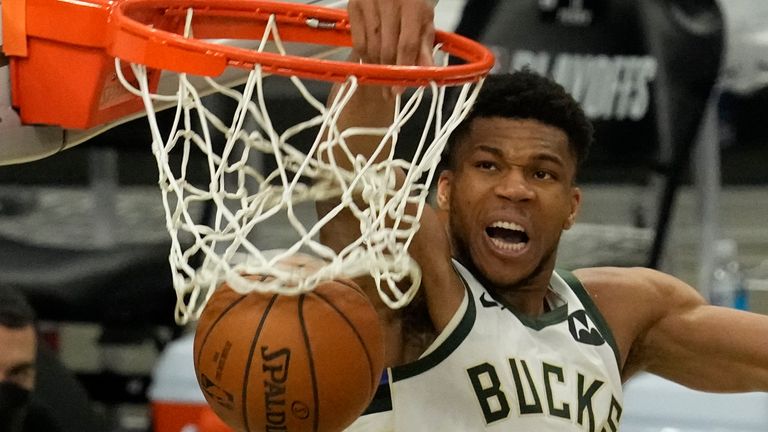 Milwaukee Bucks&#39; Giannis Antetokounmpo dunks during the second half of Game 4 of the NBA Eastern Conference basketball semifinals game against the Brooklyn Nets Sunday, June 13, 2021, in Milwaukee.