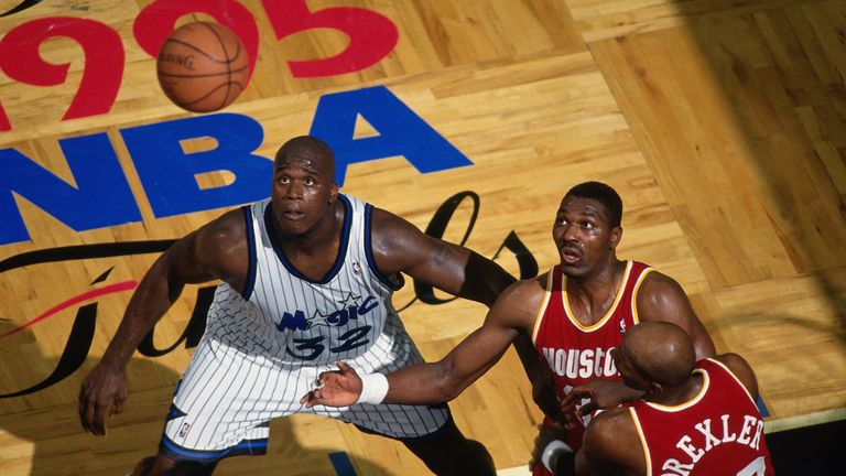 Shaquille O'Neal and Hakeem Olajuwon prepare to battle for a rebound during the 1995 NBA Finals