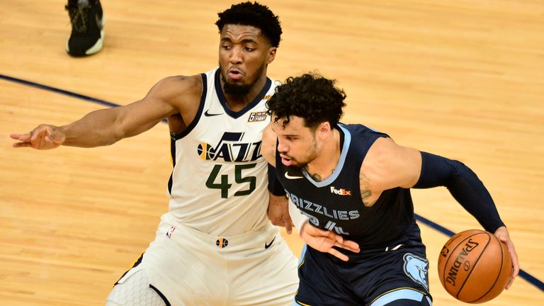 Memphis Grizzlies forward Dillon Brooks (24) handles the ball against Utah Jazz guard Donovan Mitchell (45) in the first half of Game 4 of an NBA basketball first-round playoff series Monday, May 31, 2021, in Memphis, Tenn.