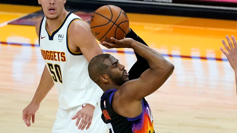 Phoenix Suns guard Chris Paul (3) shoots as Denver Nuggets forward Aaron Gordon (50) looks on during the second half of Game 1 of an NBA basketball second-round playoff series, Monday, June 7, 2021, in Phoenix.