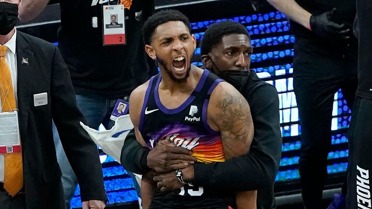 Phoenix Suns&#39; Cameron Payne, center left, celebrates with teammates during the second half of Game 2 of the NBA basketball Western Conference Finals against the Los Angeles Clippers, Tuesday, June 22, 2021, in Phoenix. 