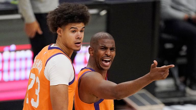 Phoenix Suns guard Chris Paul, right, complains to a referee about a call as forward Cameron Johnson looks on during the first half in Game 3 of the NBA basketball Western Conference Finals against the Los Angeles Clippers Thursday, June 24, 2021, in Los Angeles. (AP Photo/Mark J. Terrill)


