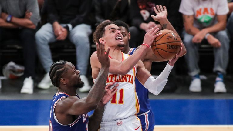 Atlanta Hawks guard Trae Young (11) drives past New York Knicks forward Julius Randle (30) in the fourth quarter of Game 5 of an NBA basketball first-round playoff series Wednesday, June 2, 2021, in New York. 