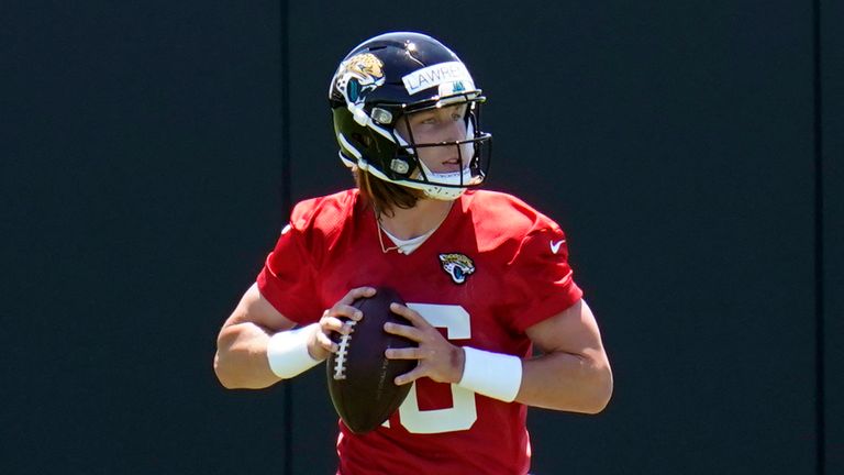 Jacksonville Jaguars quarterback Trevor Lawrence performs a passing drill during an NFL football rookie minicamp, Saturday, May 15, 2021, in Jacksonville, Fla.