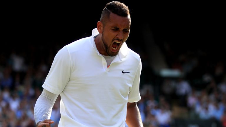 Nick Kyrgios reacts during his match against Rafael Nadal on day four of the Wimbledon Championships at the All England Lawn Tennis and Croquet Club, Wimbledon.
