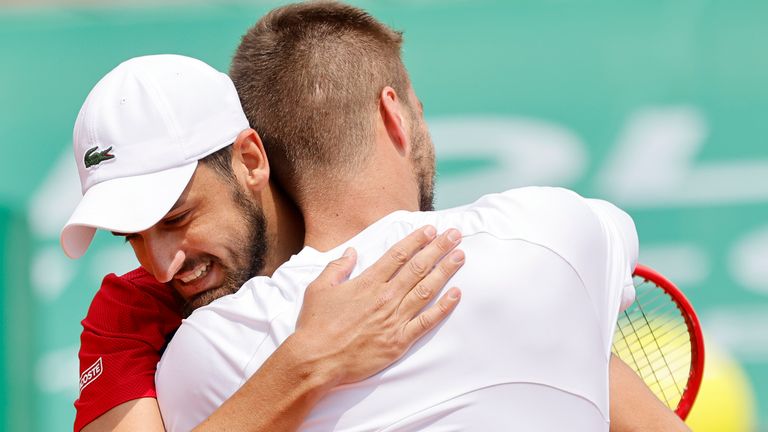 Nikola Mektic, left, and Mate Pavic, both from Croatia, celebrate after defeating Britain's Daniel Evans and Neal Skupski during their doubles final match of the Monte Carlo Tennis Masters tournament in Monaco, Sunday, April 18, 2021. (AP Photo/Jean-Francois Badias)