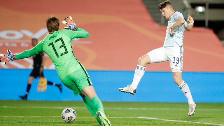 Scotland's Kevin Nisbet scores his side's second goal past Netherlands' goalkeeper Tim Krul during the international friendly soccer match between the Netherlands and Scotland at the Algarve stadium outside Faro, Portugal, Wednesday June 2, 2021. (AP Photo/Miguel Morenatti)