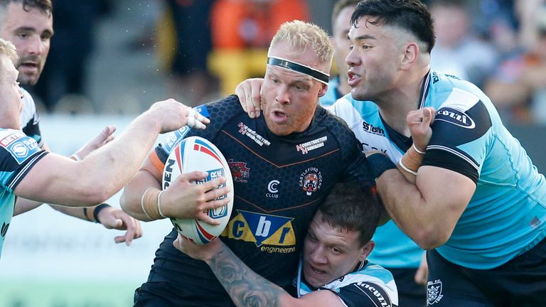 Castleford's Oliver Holmes tries to find a way through the Hull FC defence