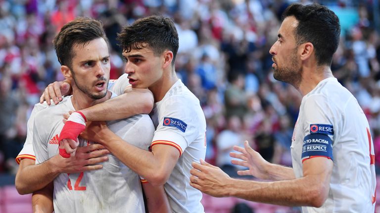 Spain&#39;s Pablo Sarabia, left, is congratulated by team mates after scoring his side&#39;s first goal during the Euro 2020 soccer championship round of 16 match between Croatia and Spain at the Parken Stadium in Copenhagen