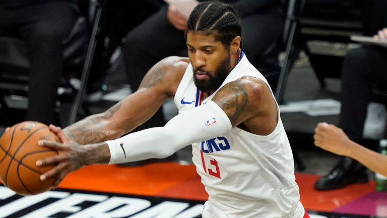 Los Angeles Clippers star Paul George grabs a rebound during the first half of Game 5