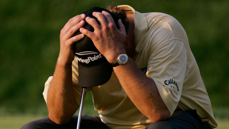 Mickelson hangs his head after a final-hole meltdown at Winged Foot in 2006
