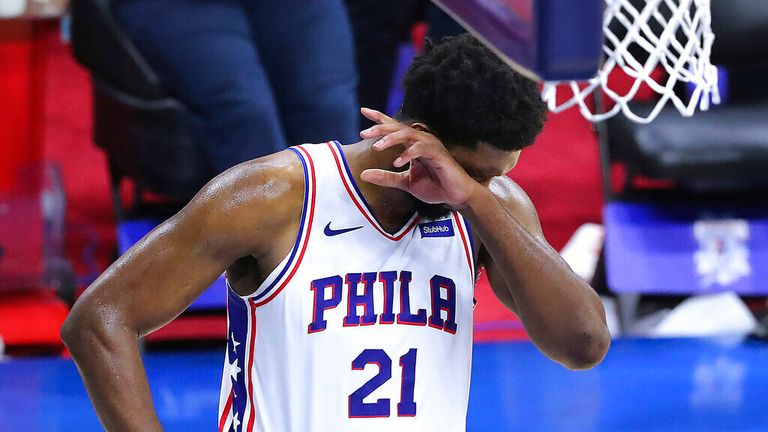Philadelphia 76ers center Joel Embiid reacts in the final seconds of a 103-96 loss to the Atlanta Hawks in Game 7 of their NBA Eastern Conference semifinal basketball game, Sunday, Jun 20, 2021, in Philadelphia. (Curtis Compton/Atlanta Journal-Constitution via AP)