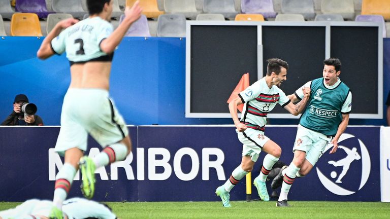 Portugal players celebrate the late own goal that sent them to the final