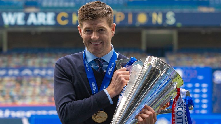 GLASGOW, SCOTLAND - MAY 15: Steven Gerrard celebrates with the Scottish Premiership Trophy at full time during the Scottish Premiership match  between Rangers and Aberdeen  at Ibrox Stadium, on May 15, 2021, in Glasgow, Scotland. (Photo by Craig Williamson / SNS Group)