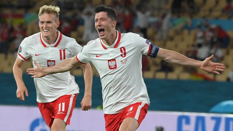 Poland&#39;s Robert Lewandowski celebrates scoring against Spain