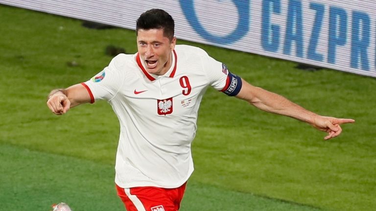 Poland&#39;s Robert Lewandowski celebrates scoring against Spain